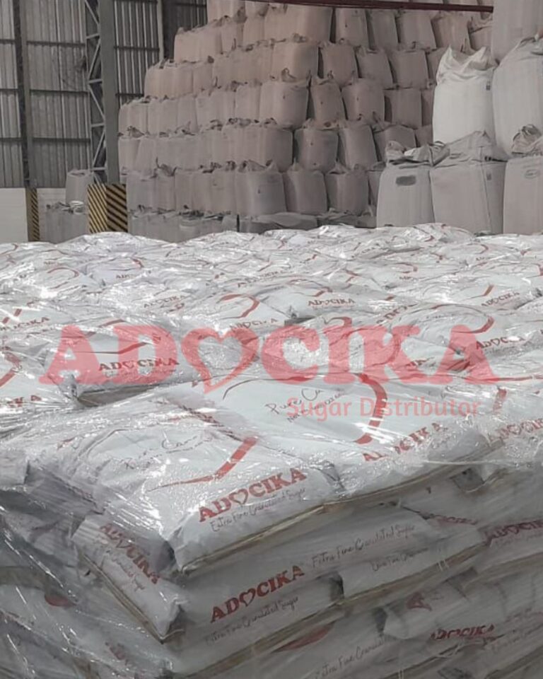 ADOCIKA branded sugar bags stacked in warehouse